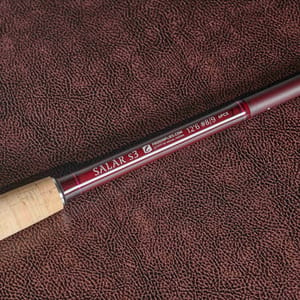 Frodin Salar s3 dh fly rods detail shot of the rod logo on burgundy leather background