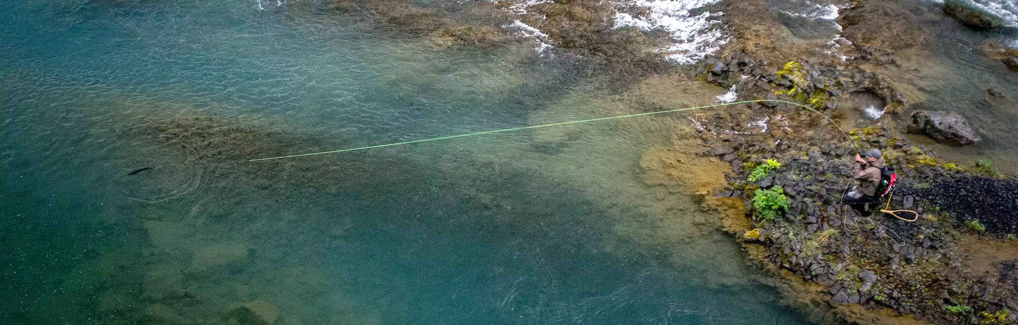 Salmon Fishing in Iceland Angler fighting a fish whilst Salmon Fishing In Iceland
